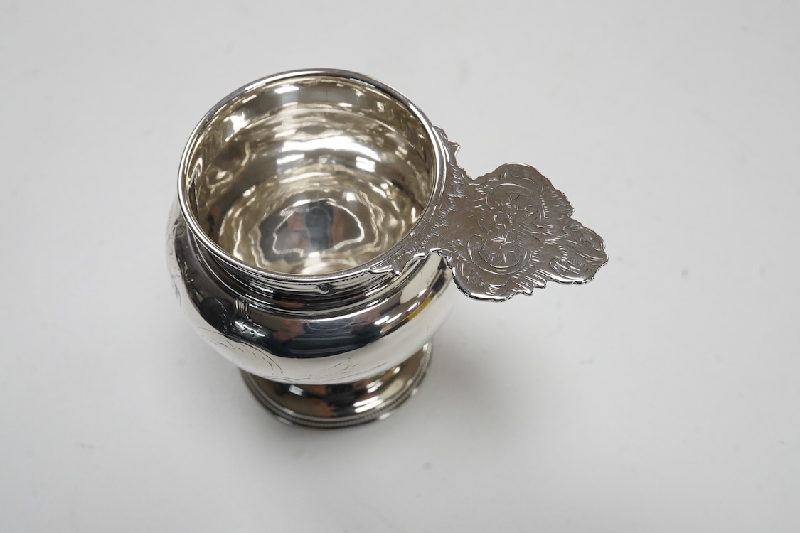 A late 19th/early 20th century Russian 84 zolotnik cream jug, with engraved decoration and angular feet and handle, master Andrei Ivanov, 1908-1917 kokoshnik mark, height 11.6cm, together with a similar single handled sm